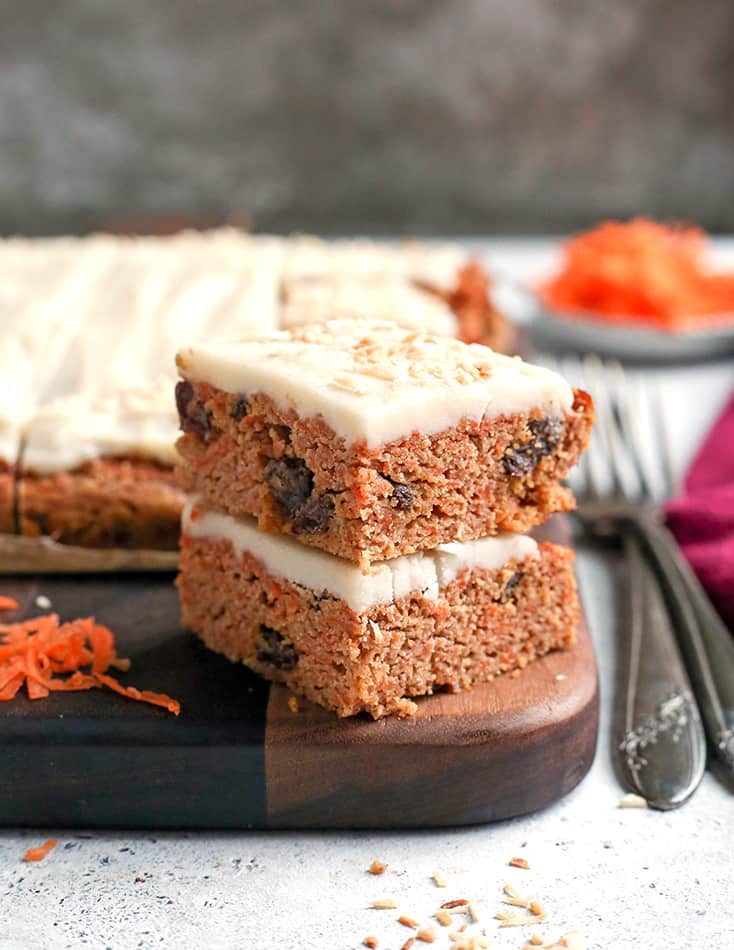 nut free carrot cake bars, stacked with forks on the side