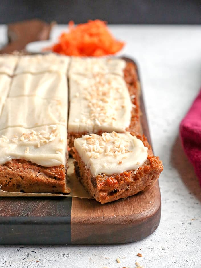 paleo nut free carrot cake bars showing a piece cut out