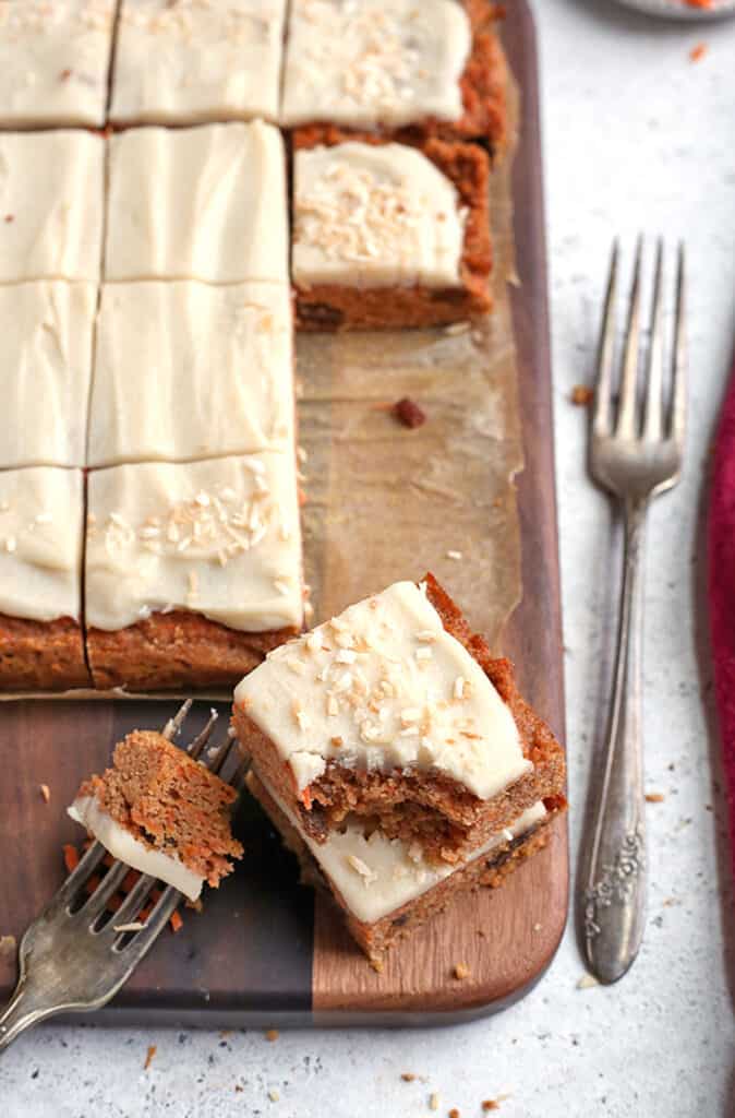 paleo nut free carrot cake bars with a bite shown out of them