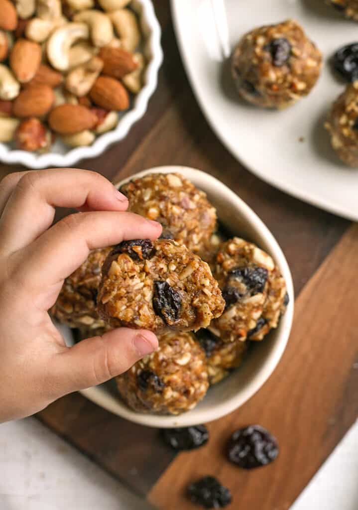 tart cherry granola bites, hand taking one