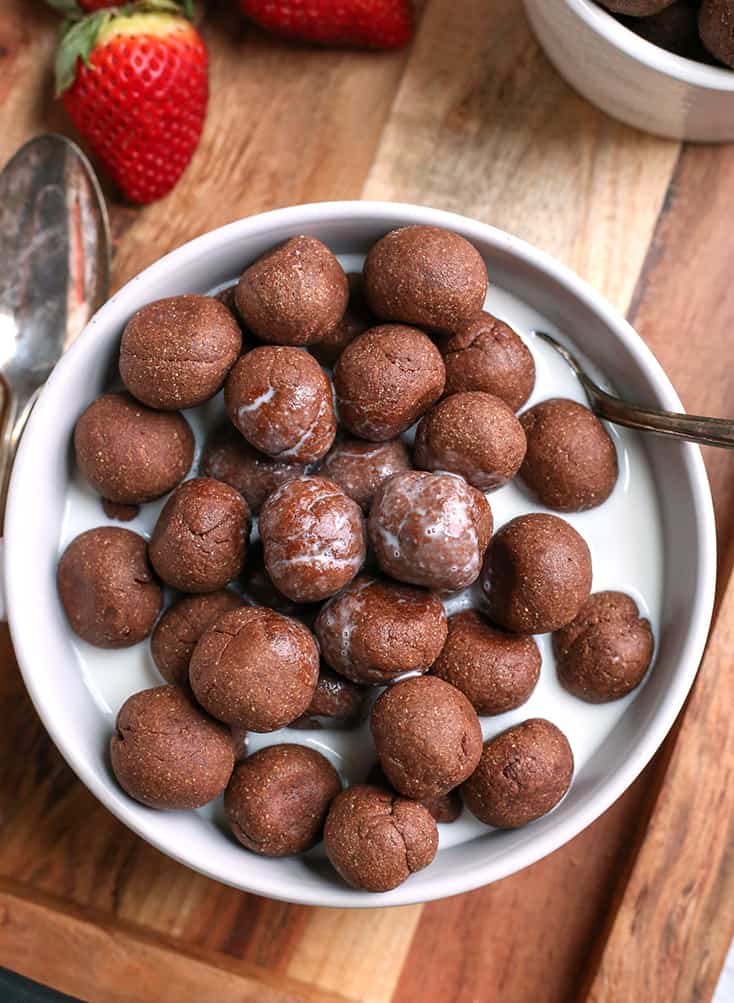 nut free paleo cocoa puffs in a bowl with almond milk 