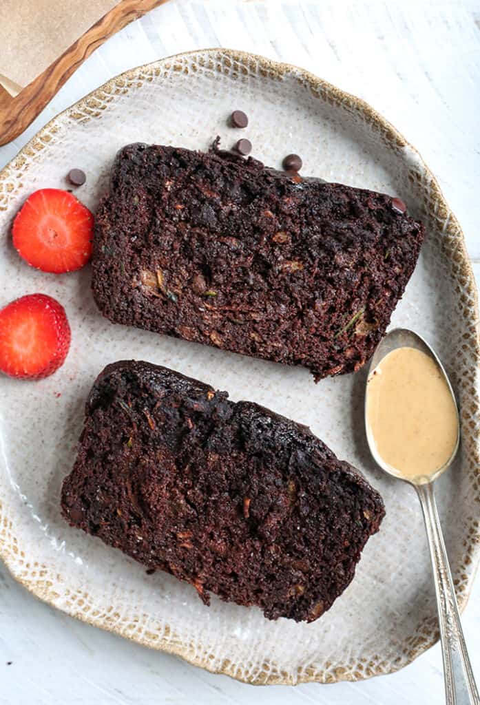 2 slices of chocolate vegan paleo zucchini bread on a plate