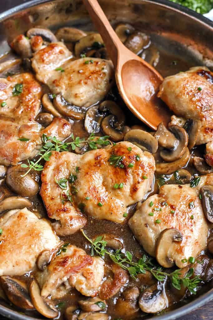 creamy paleo mushroom chicken in the pan with fresh thyme