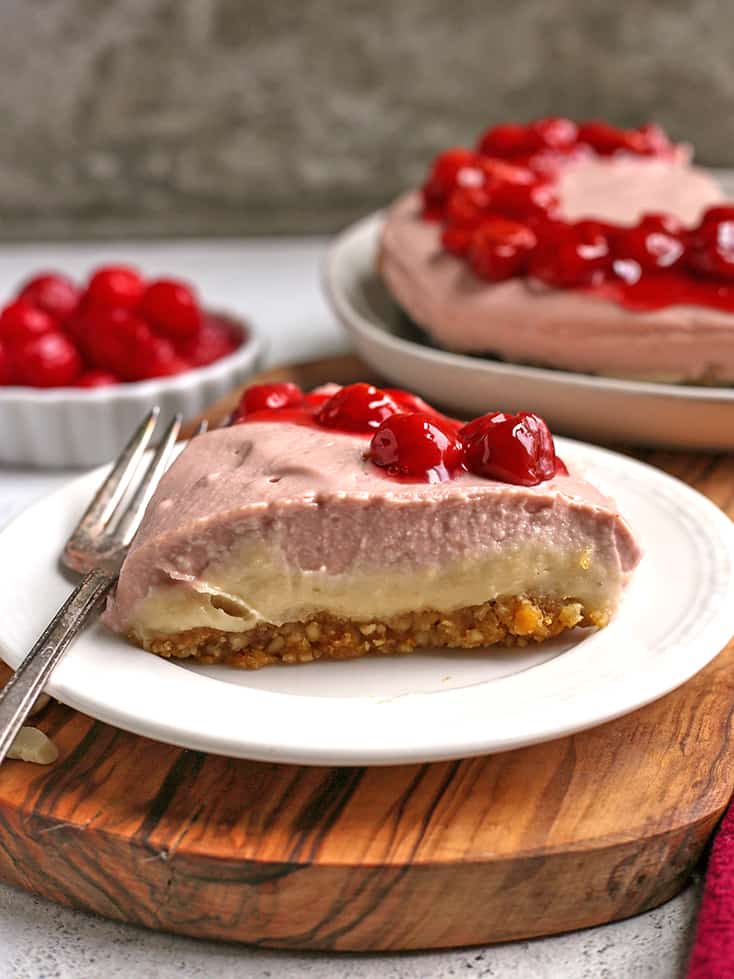 piece of paleo vegan cherry cheesecake on a plate. 