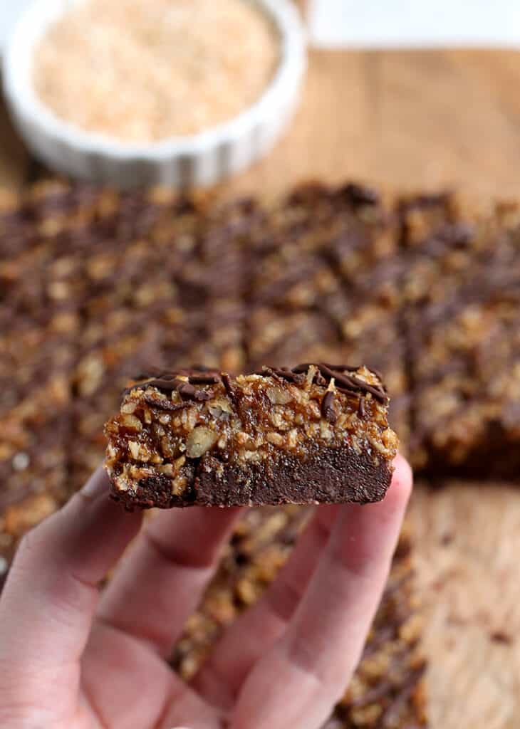 hand holding a paleo vegan german chocolate brownie