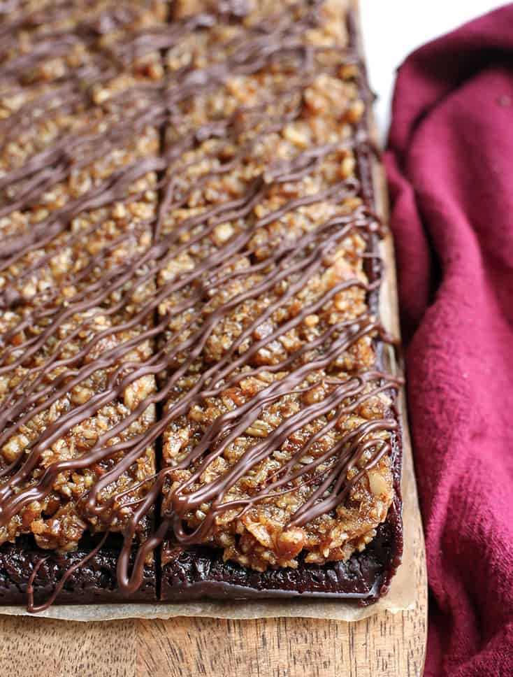 vegan paleo german chocolate brownies. Cut and drizzled with chocolate