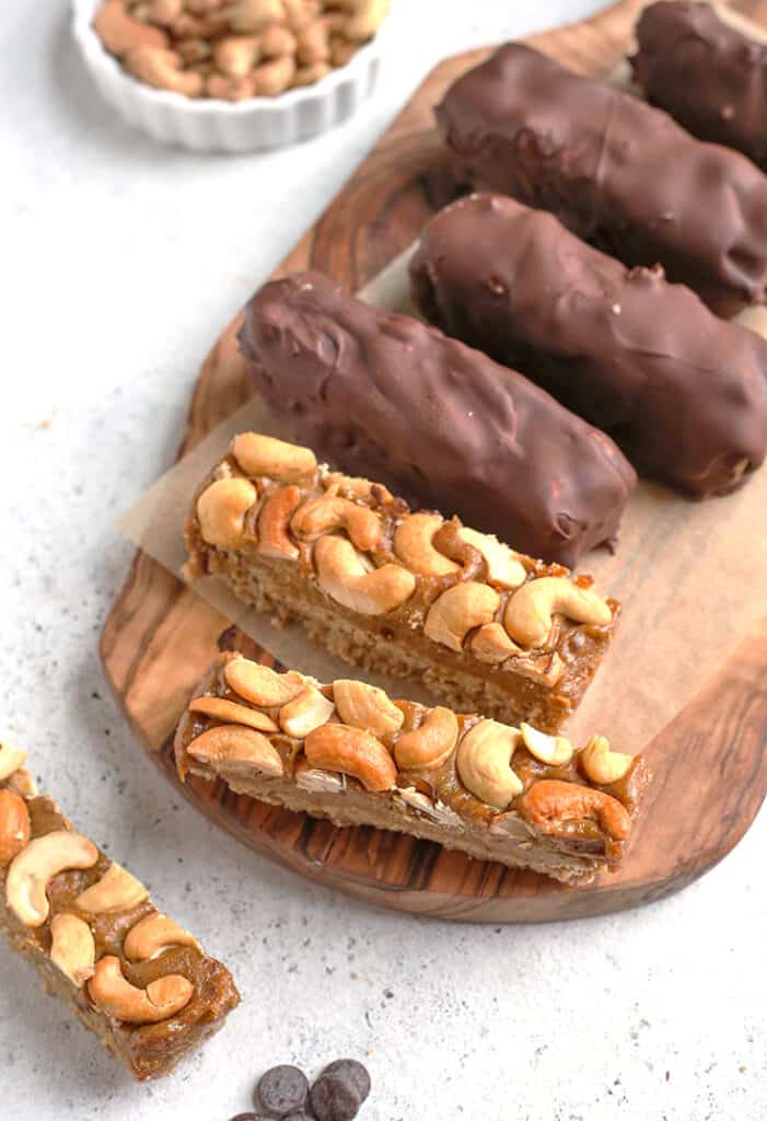 paleo vegan snickers bars. Some covered in chocolate, some with the cashews showing
