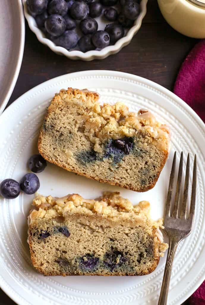 two slices of blueberry streusel bread on a plate