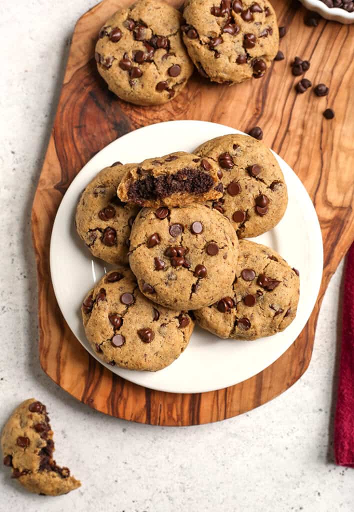 a plate of paleo vegan brownie stuffed chocolate chip cookies