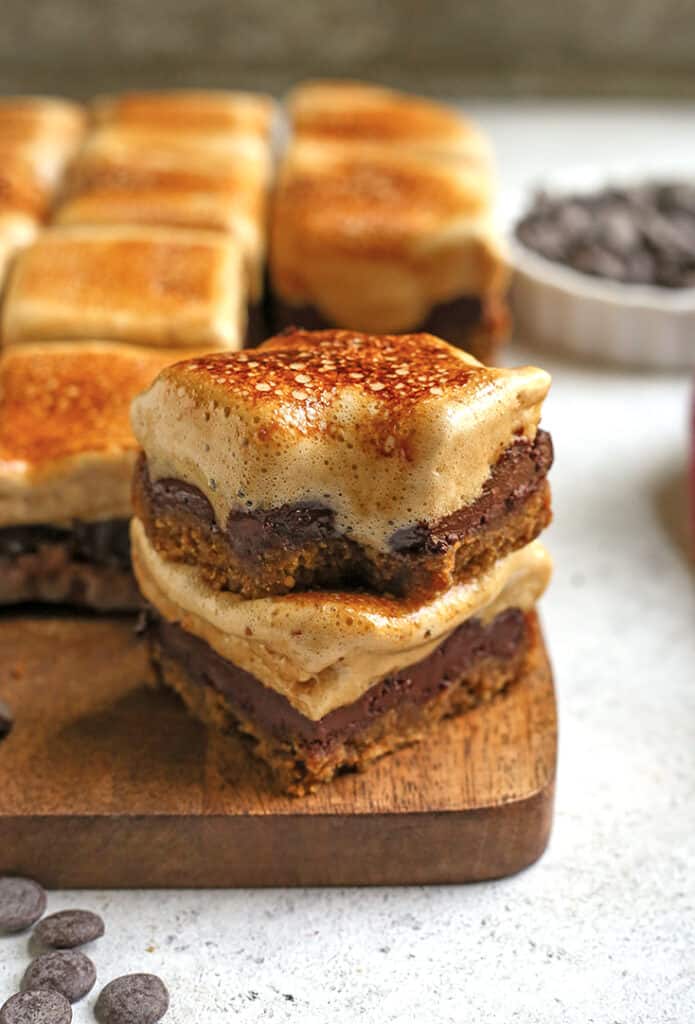 stack of s'more cookie bars with a bite taken out of one 