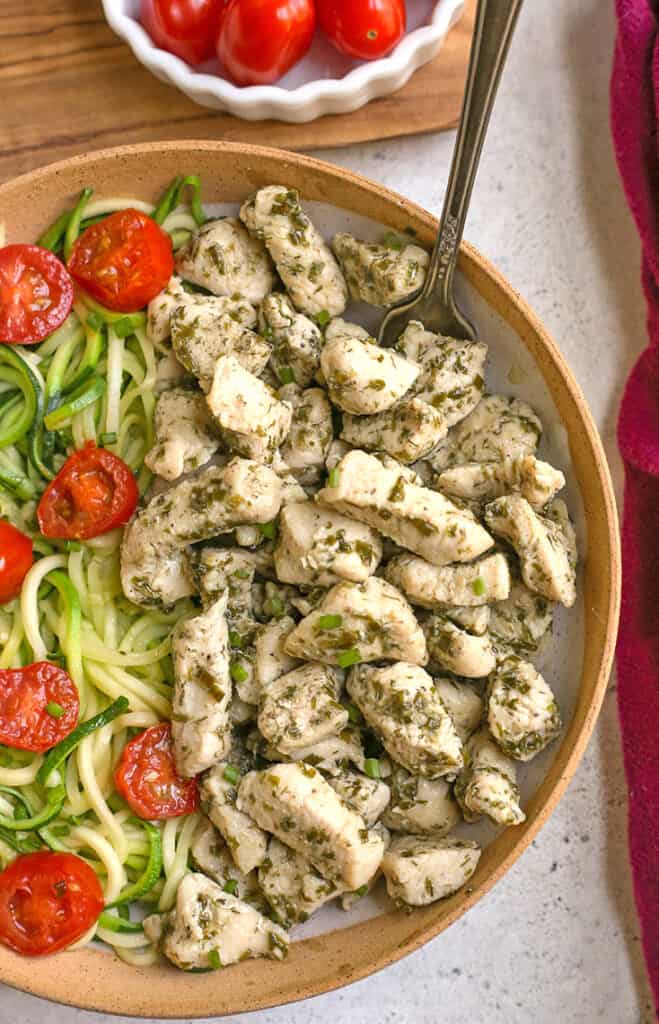 ranch chicken bites in a bowl with zucchini noodles and a fork