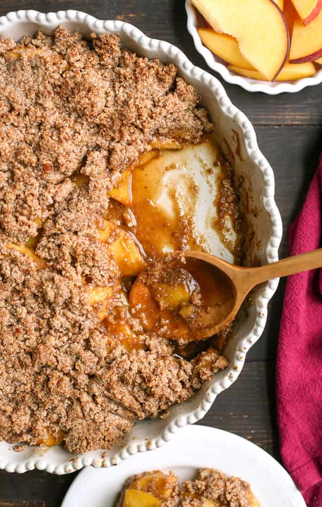 paleo peach crisp with a spoonful taken out