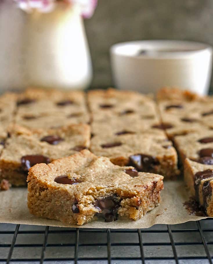 grain free brown butter blondies with a bite taken out of one