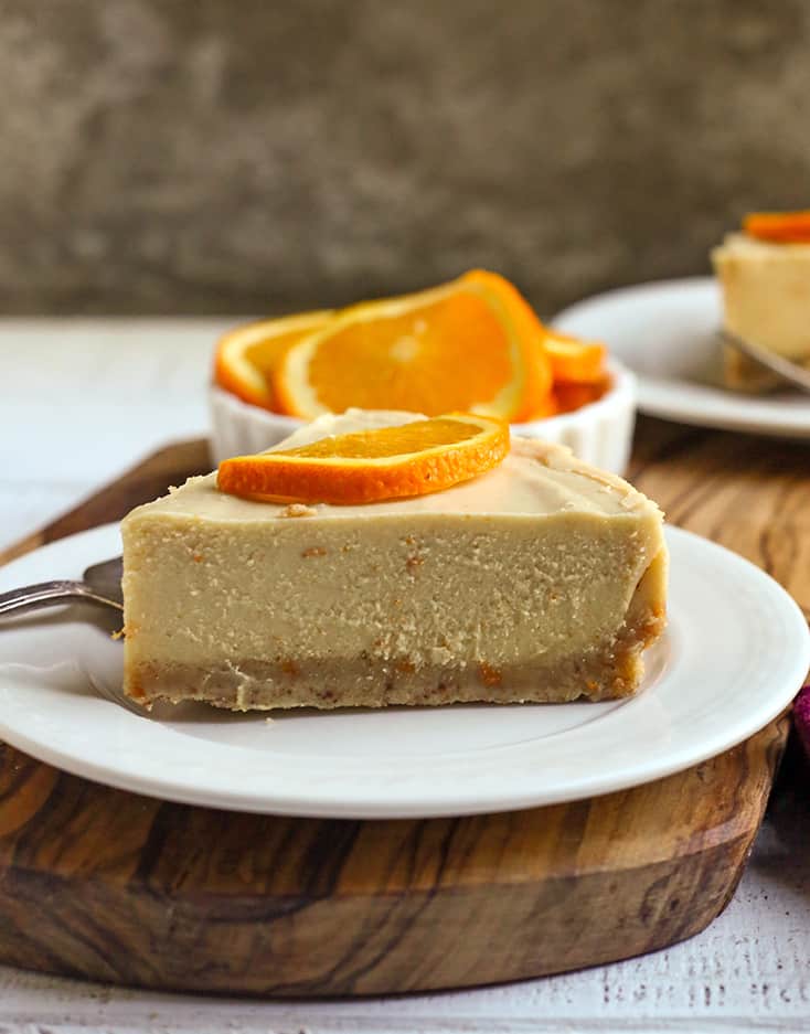 side view of a slice of paleo vegan creamsicle cheesecake 