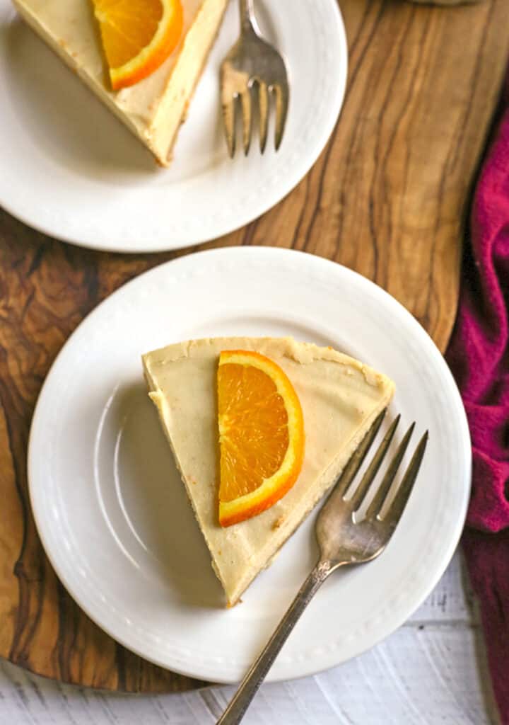 slice of paleo orange creamsicle cheesecake on a plate