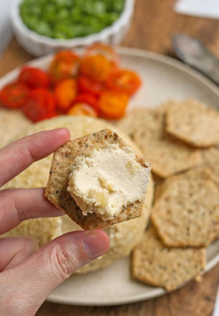 cheeseball spread on a cracker, close up 