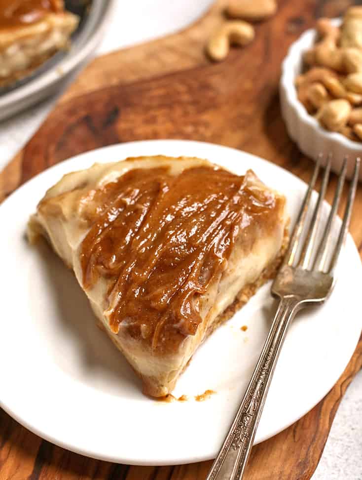 a slice of paleo vegan cinnamon roll cheesecake