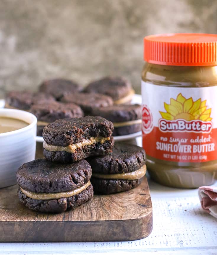 paleo chocolate sandwich cookies on a cutting board