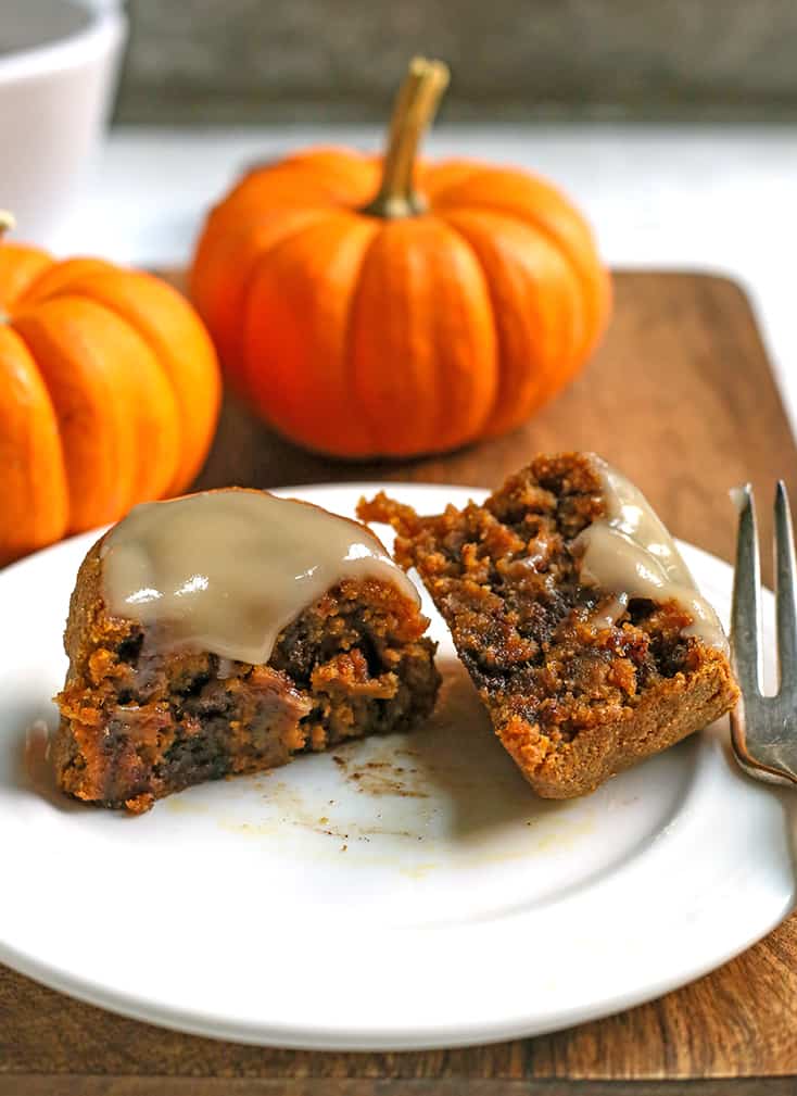 paleo pumpkin cinnamon roll, cut in half with glaze on top 