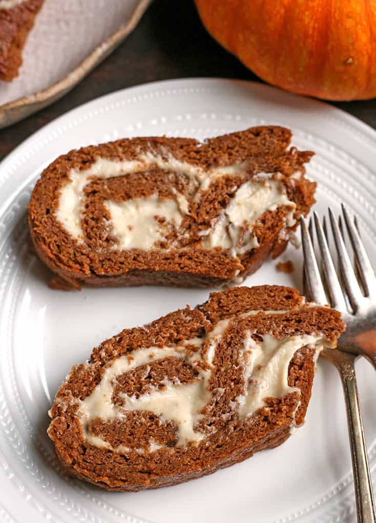 two slices of paleo pumpkin roll, showing the filling 