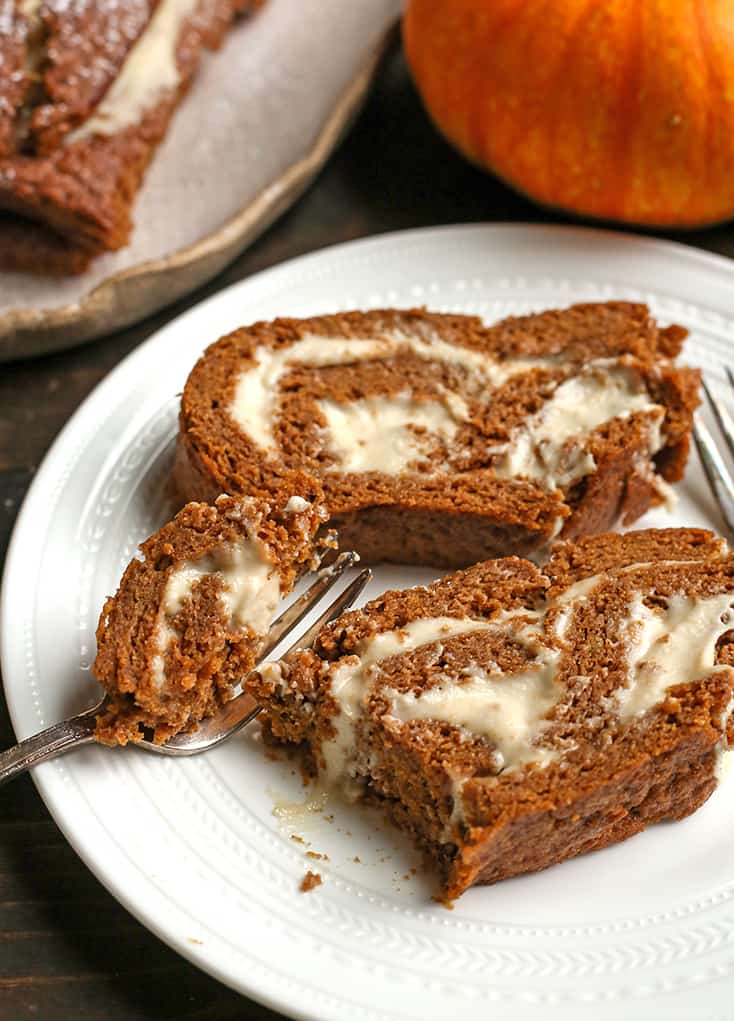 a bite taken out of a piece of paleo pumpkin roll