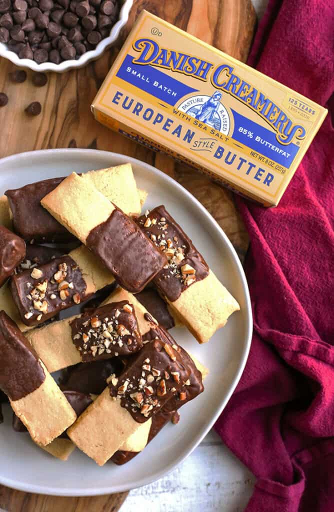 a plate of chocolate dipped grain free shortbread cookies