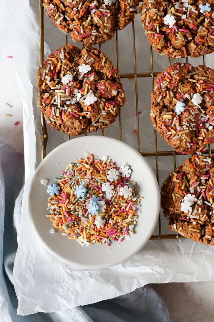 close up shot of paleo sprinkle cookies on a cooling rack