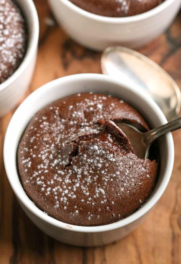 paleo chocolate fudge cups with a spoon digging in 