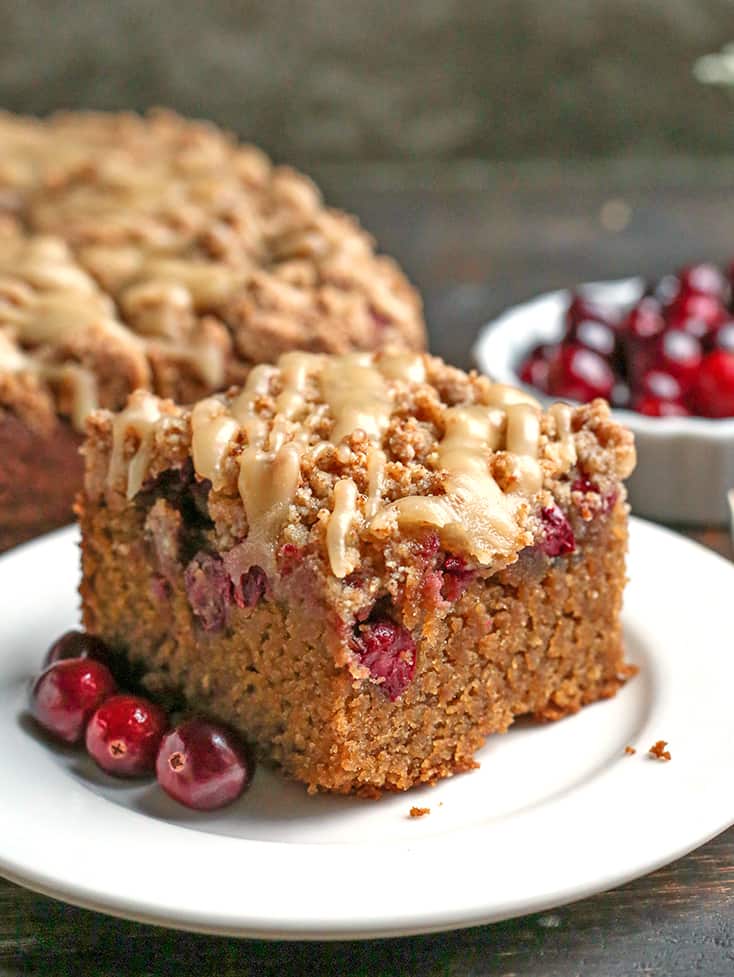 a side shot of a piece of paleo cranberry coffee cake 