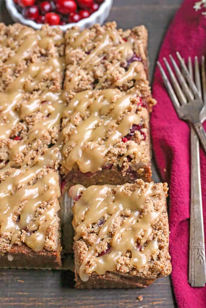 top view of paleo cranberry coffee cake showing the glaze on top 