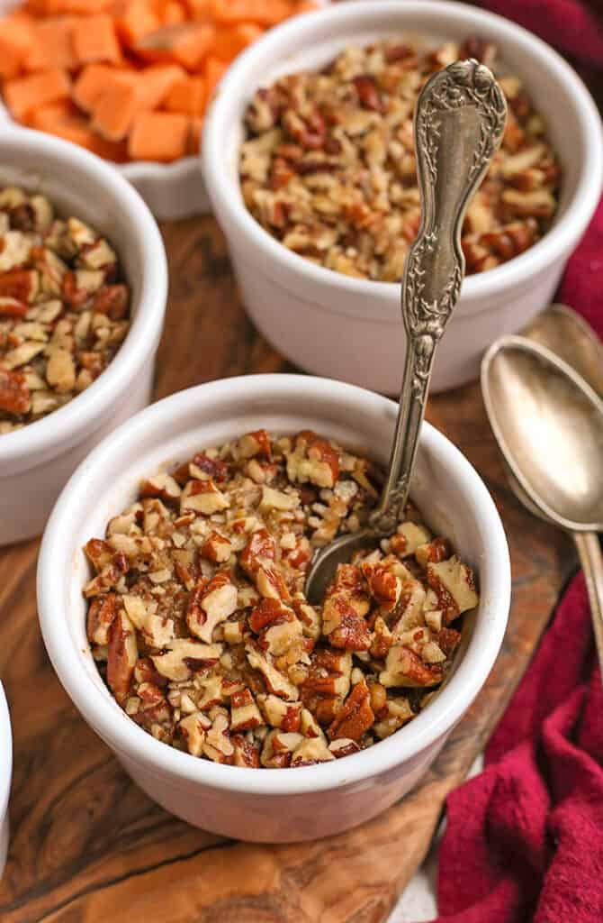 paleo sweet potato pecan dessert cups, with a spoon in one 