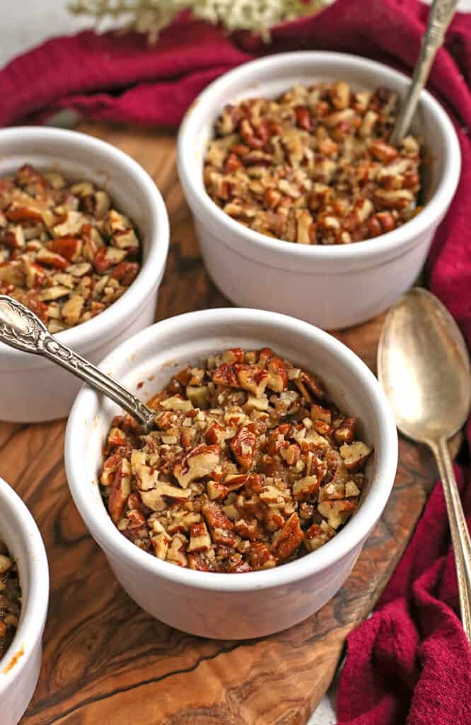 spoon in a ramekin of paleo sweet potato pecan dessert cup