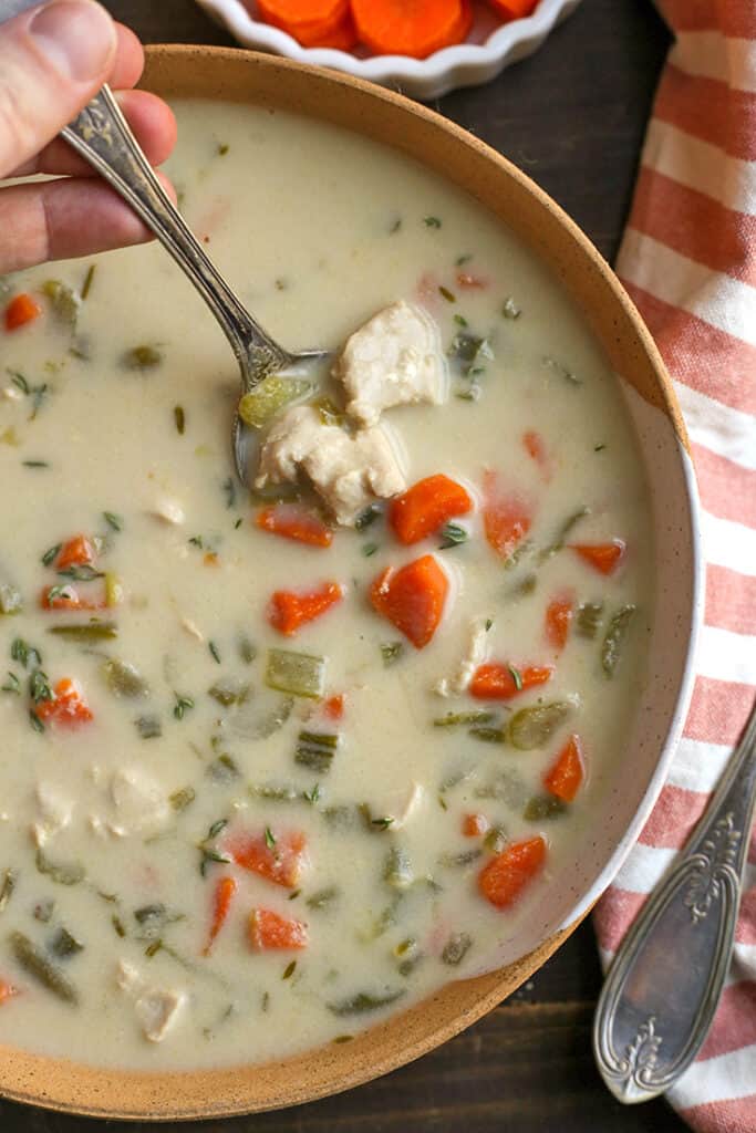 spoon in a bowl of paleo whole30 creamy chicken soup