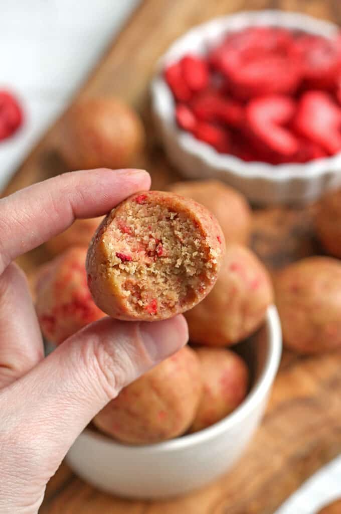 hand holding a paleo vegan strawberry shortcake bite