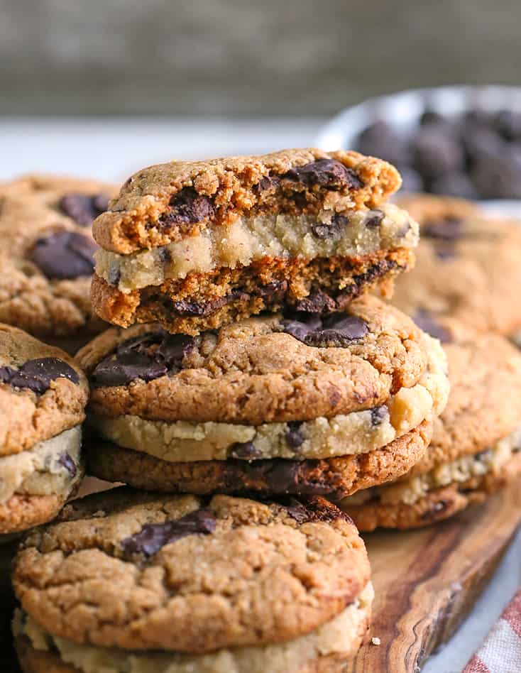 stacked paleo chocolate chip cookie dough sandwiches. One broken in half so the center is showing