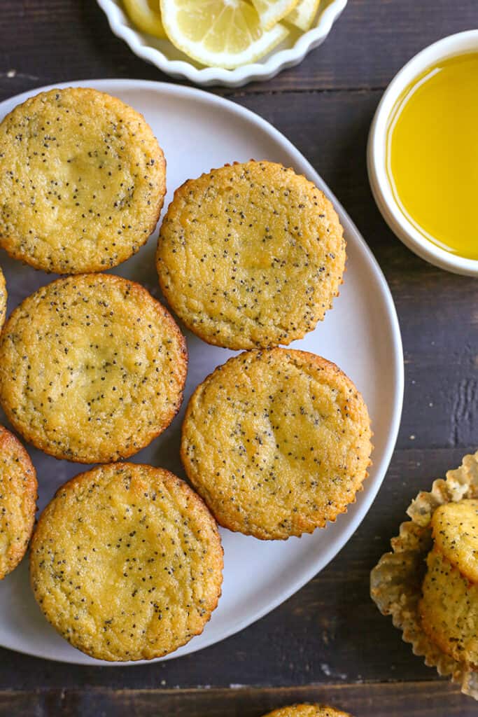 top view of a plate of paleo lemon poppy seed muffins without glaze