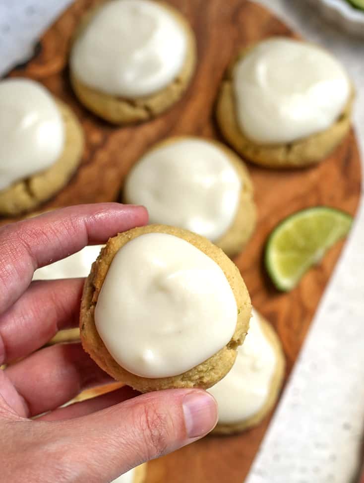 a hand holding a paleo soft lime cookie