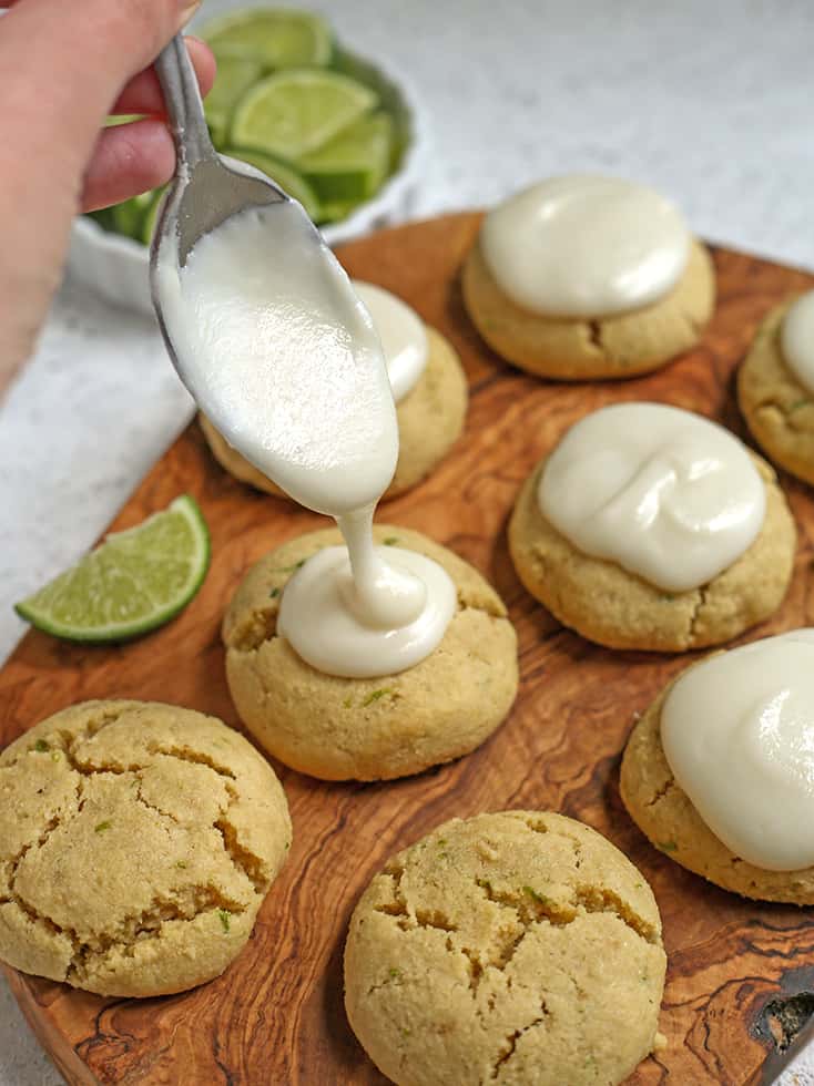 glaze being dripped on paleo lime cookies 