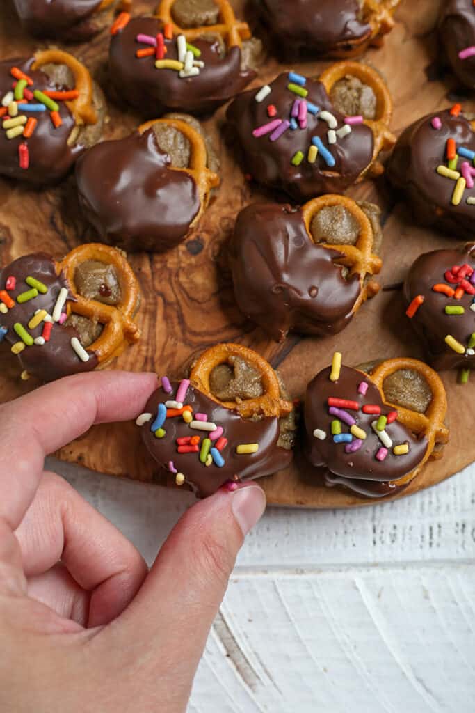 hand grabbing a sunbutter pretzel bite