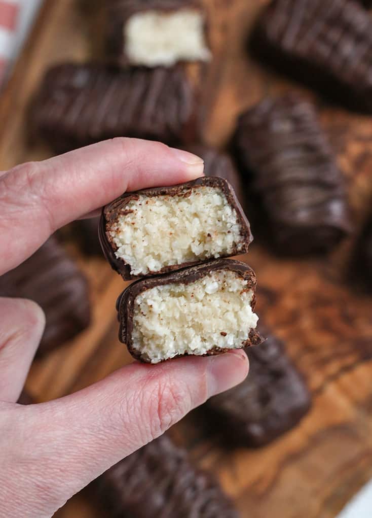 hand holding a paleo vegan mounds candy bar