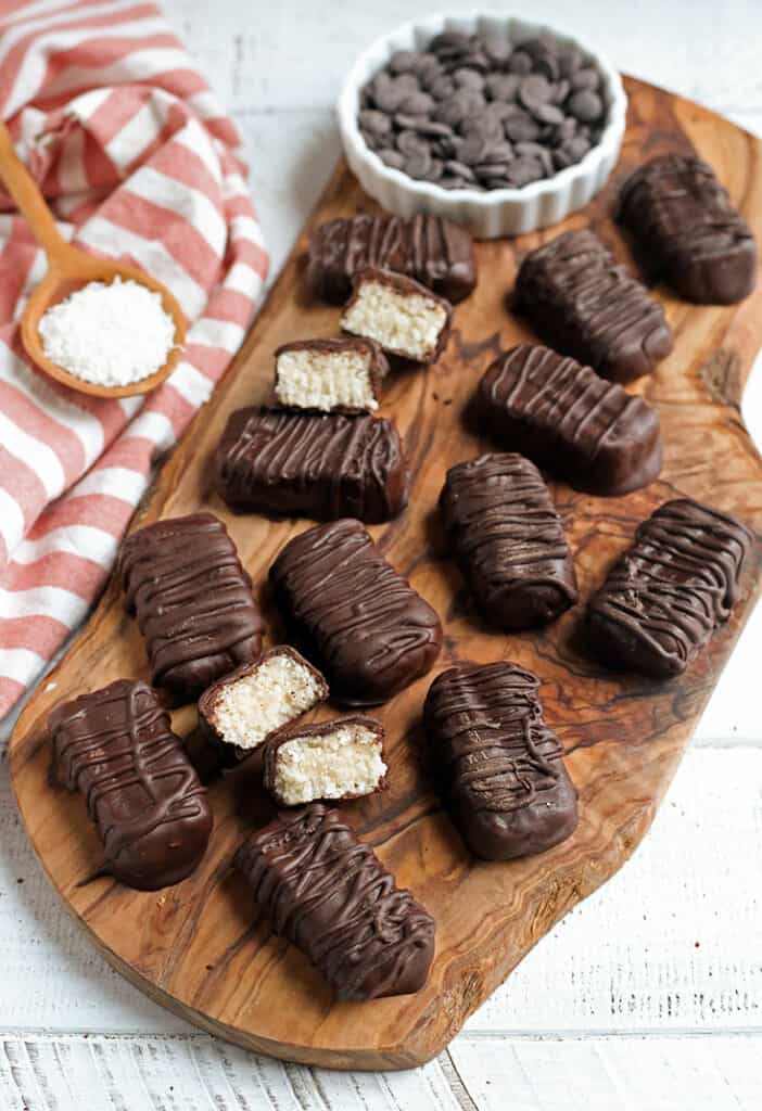 multiple paleo vegan mounds on a wooden cutting board