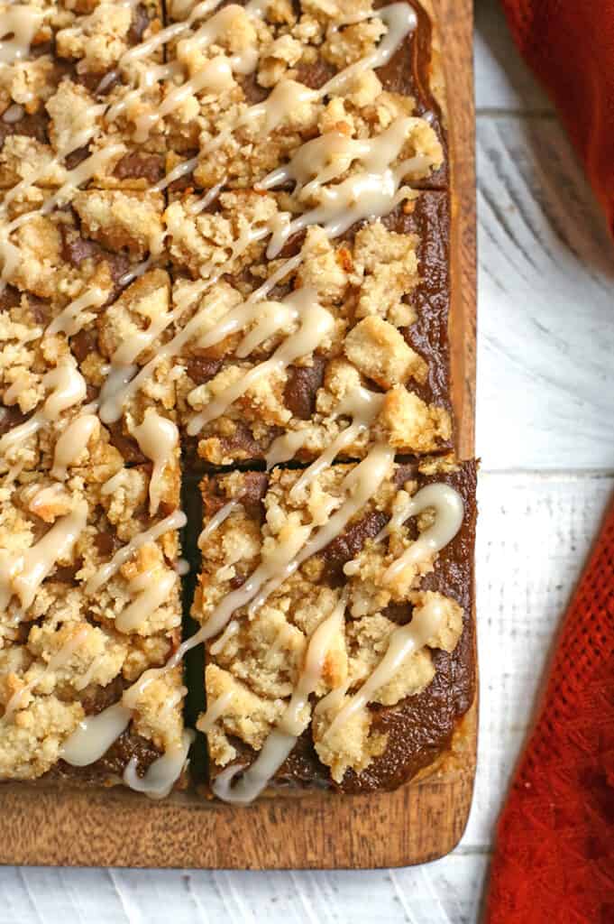 cutting board with paleo pumpkin pie crumb bars on it