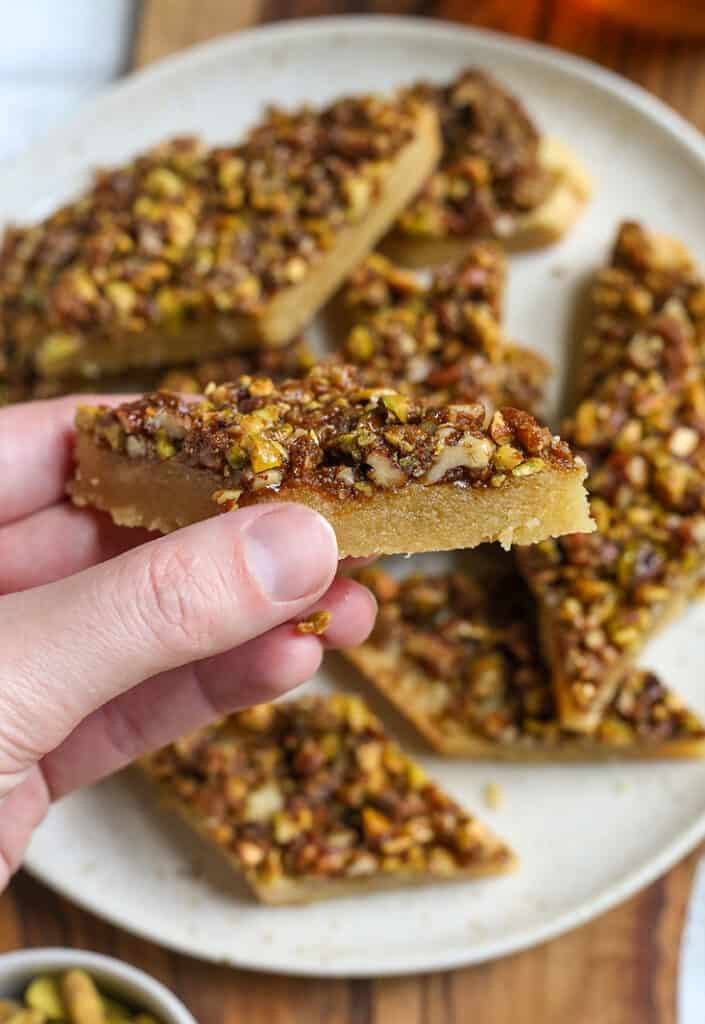 hand holding a gluten free baklava bar