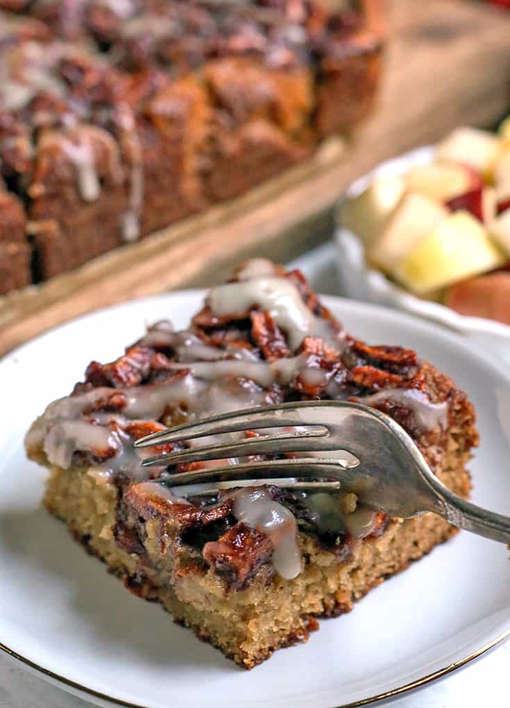 a fork taking a bite of paleo apple cake