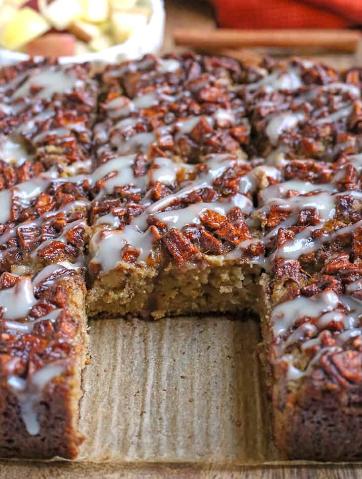 paleo apple cake with a piece missing and center showing 