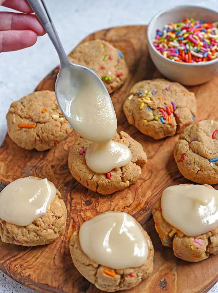 glaze being added to the paleo sprinkle cookies 