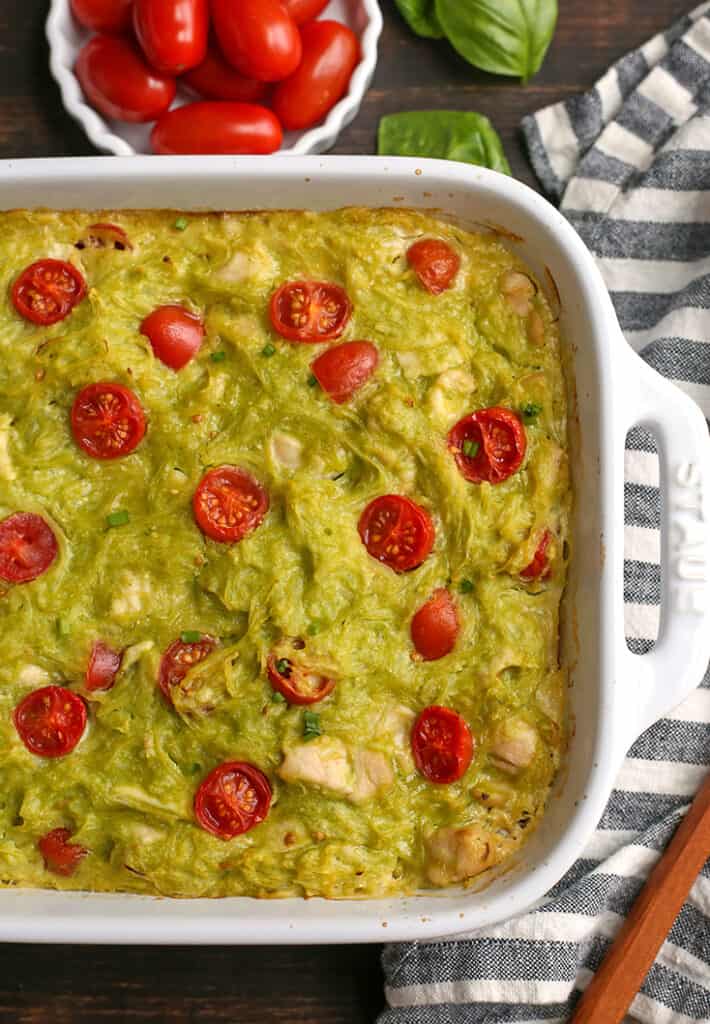 gluten free paleo pesto chicken casserole with tomatoes on top 