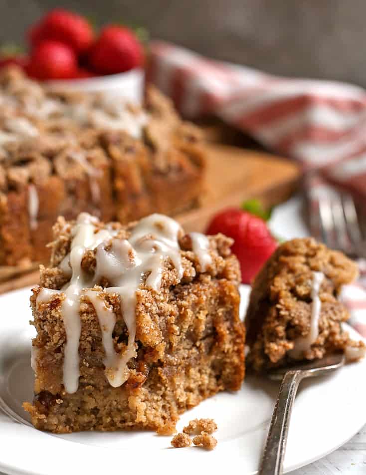 a bite taken out of sour cream coffee cake, crumb layers showing 