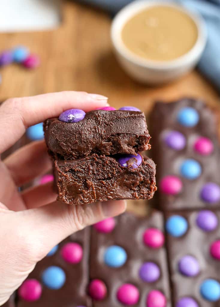 hand holding a stack of two cosmic brownies 