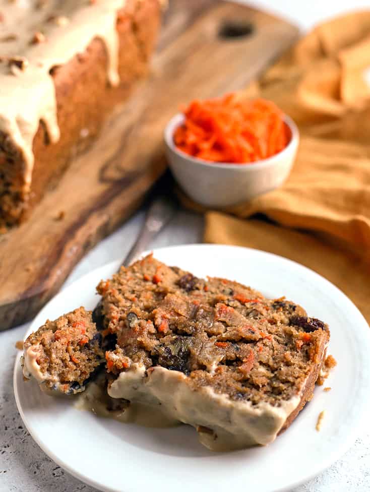 frosting showing on a slice of healthy carrot cake bread 